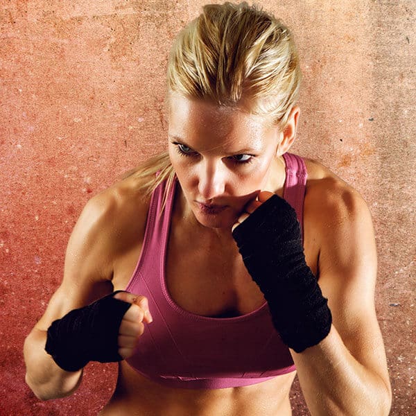 Mixed Martial Arts Lessons for Adults in Escondido CA - Lady Kickboxing Focused Background