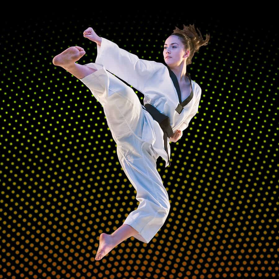 Martial Arts Lessons for Adults in Escondido CA - Girl Black Belt Jumping High Kick